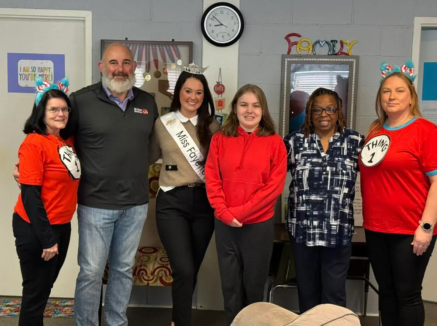 iss Fayetteville visiting Re-Store Warehouse staff and supporters during a Read Across America Dr. Seuss themed event