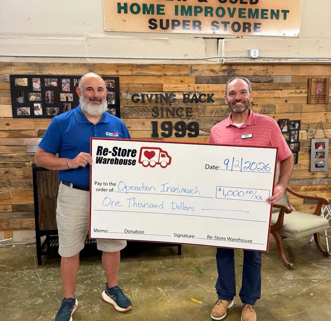 Re-Store Warehouse presenting a $5,000 donation check to Fayetteville Operation Inasmuch